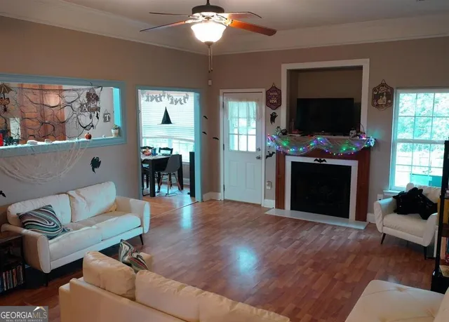 a living room with furniture and a fireplace