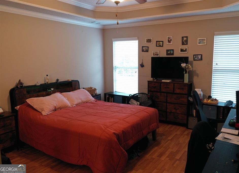 201 Boulder Creek Road Kathleen, GA 31047 - Photo 8 of 21 a bedroom with a bed and a flat screen tv