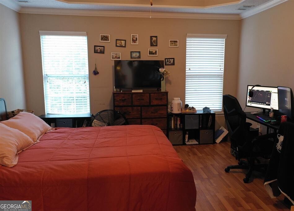201 Boulder Creek Road Kathleen, GA 31047 - Photo 9 of 21 a bedroom with a bed and wooden floor