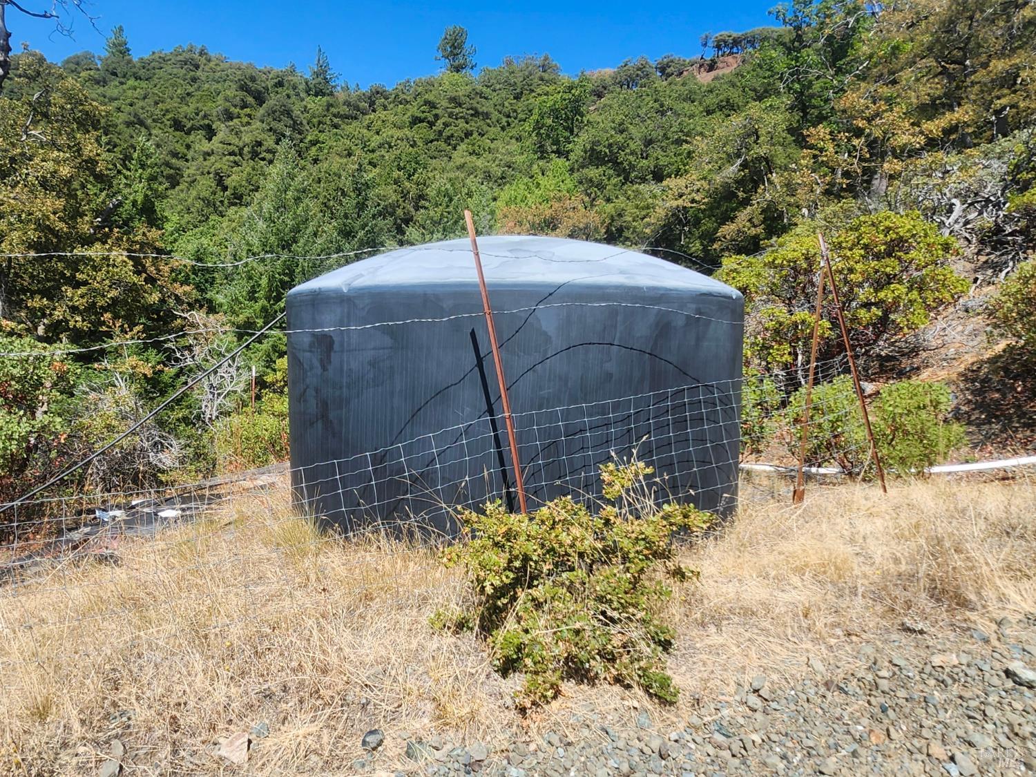 5635 Iron Peak Road Laytonville, CA 95454 - Photo 15 of 15 a wooden fence with trees in the background