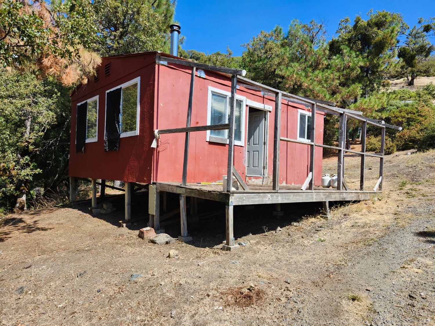 5635 Iron Peak Road Laytonville, CA 95454 - Photo 3 of 15 a front view of a house with a yard
