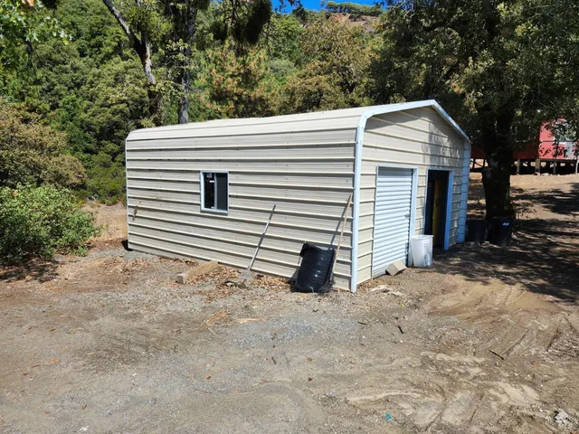 a view of a house with a yard and garage