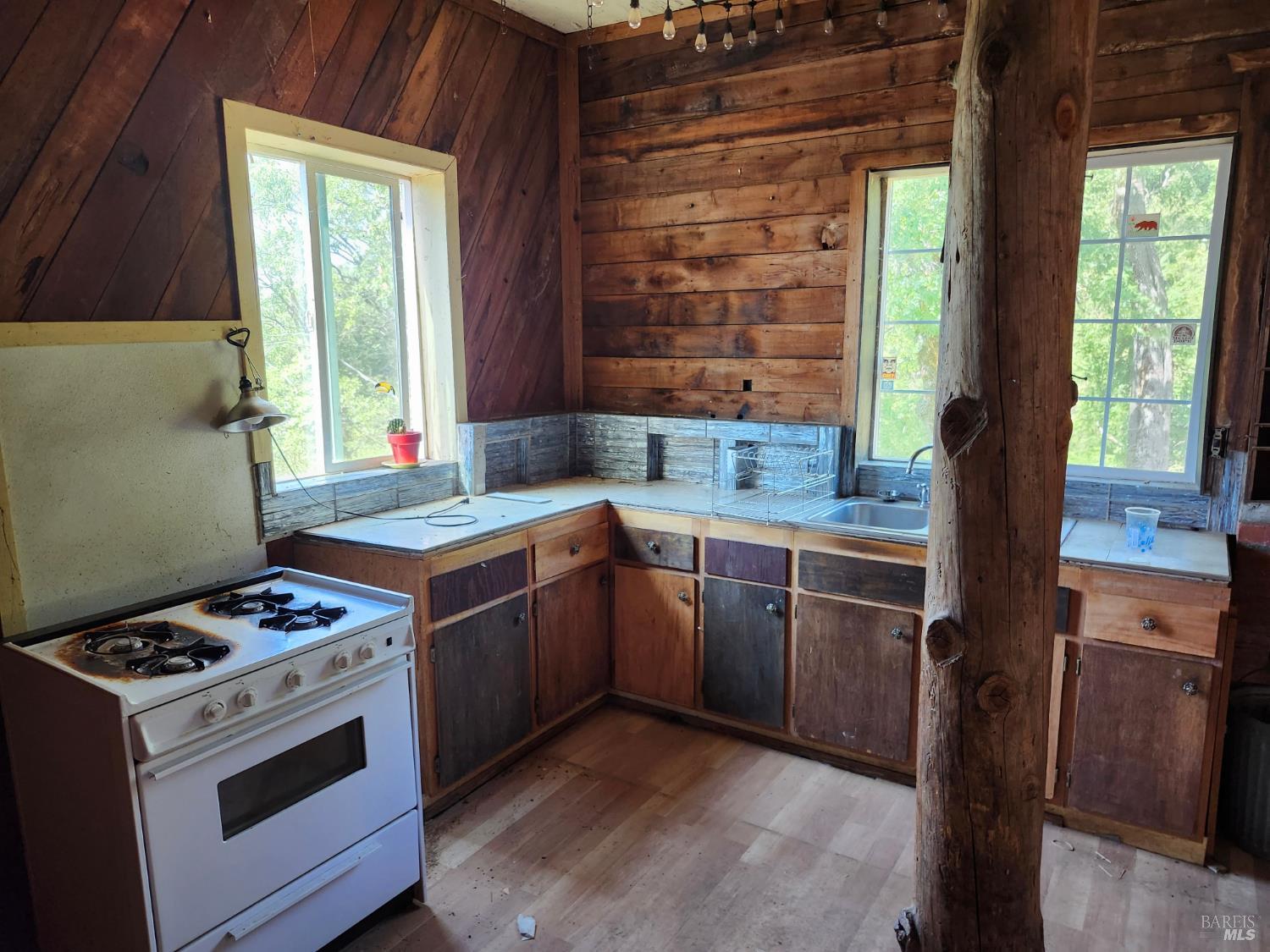 5635 Iron Peak Road Laytonville, CA 95454 - Photo 9 of 15 a kitchen with a stove a sink and a window