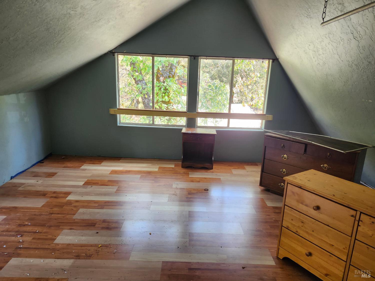 5635 Iron Peak Road Laytonville, CA 95454 - Photo 10 of 15 a bedroom with a bed and a window