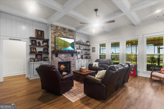 a bedroom with a bed chairs and window