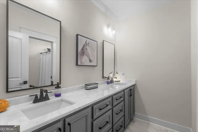 a large kitchen with kitchen island a stove a sink a refrigerator and a dining table with wooden floor