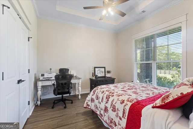a kitchen with refrigerator and cabinets