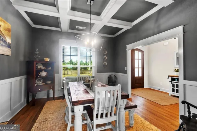 a room with kitchen island a chandelier and a chandelier