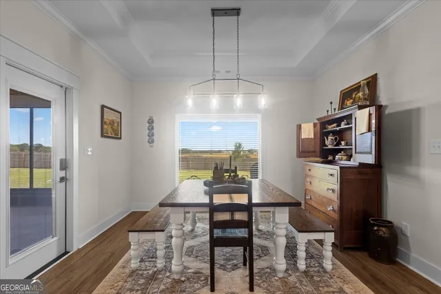 a bathroom with a granite countertop toilet and a sink