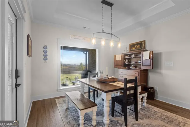 a view of a kitchen with stainless steel appliances granite countertop a refrigerator and a stove top oven