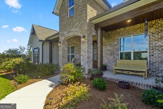 a view of a dining room with furniture water heater and a chandelier