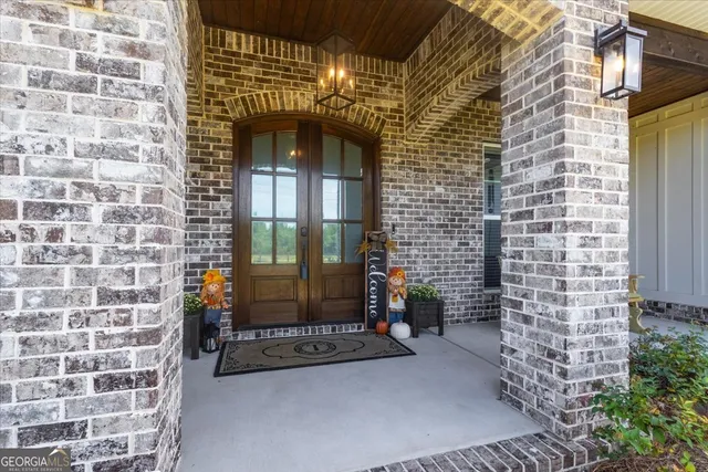 a living room with fireplace furniture and a wooden floor