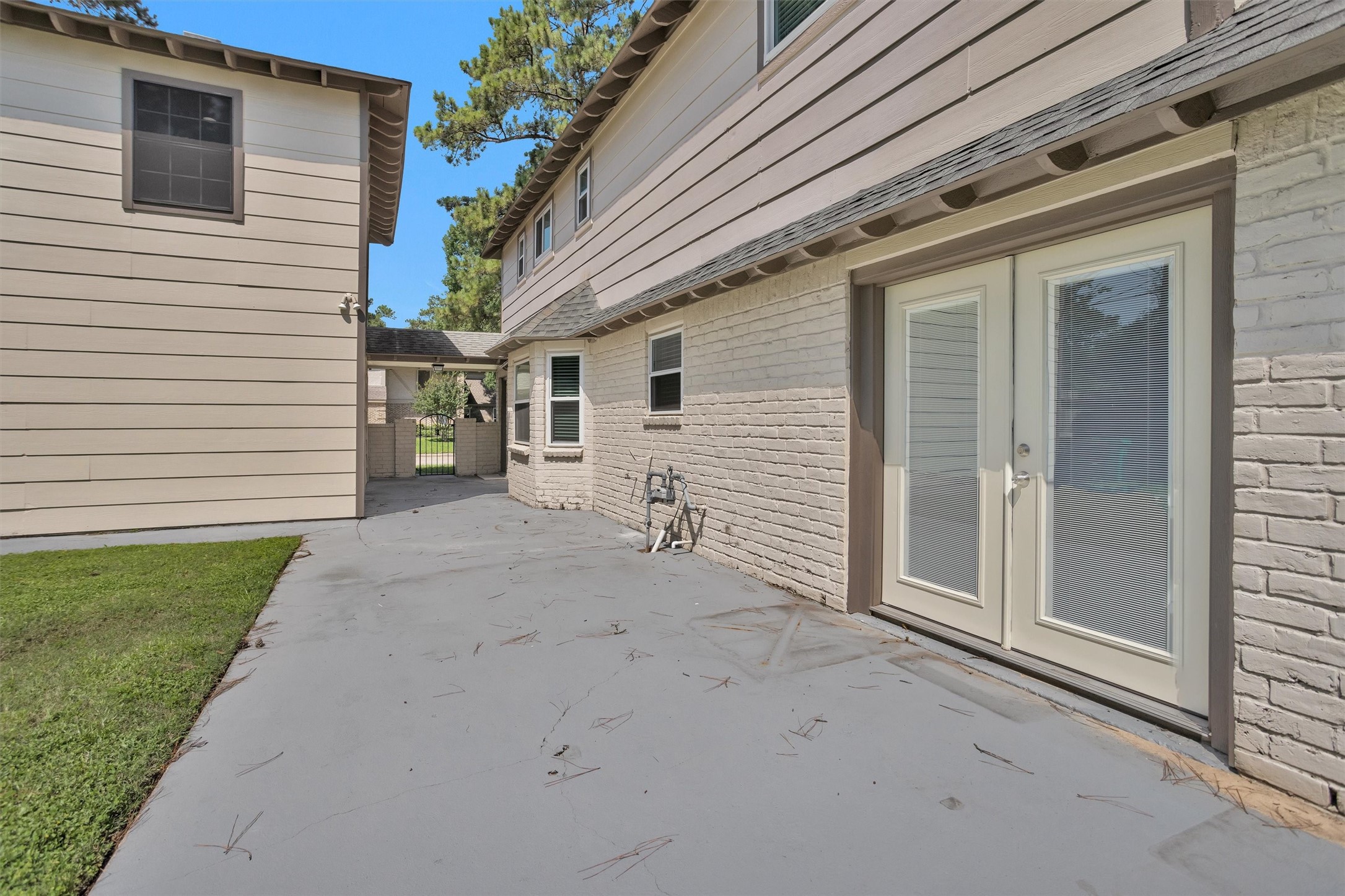 9115 Godstone Lane Spring, TX 77379 - Photo 37 of 46 Spacious backyard patio ideal for relaxation and entertaining.