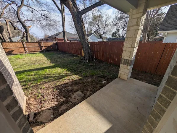 a view of a backyard with tree s