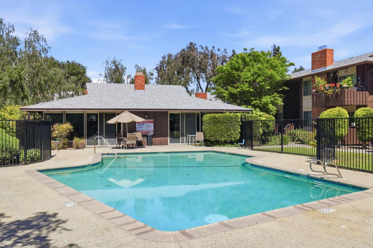 100 East Middlefield Road, Unit 3B Mountain View, CA 94043 - Photo 30 of 32 a view of a house with swimming pool and sitting area