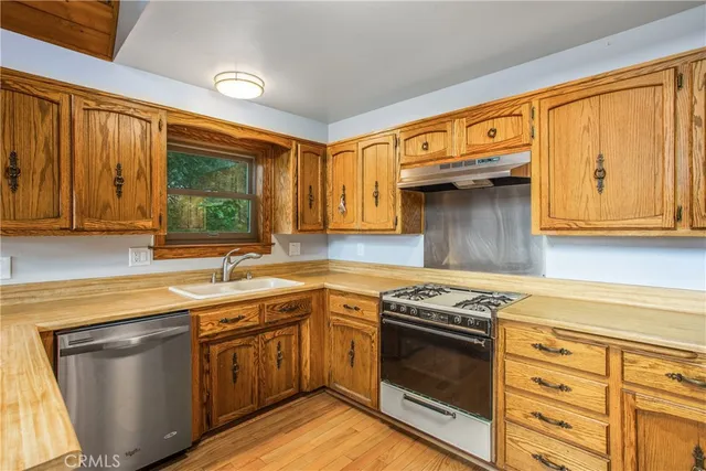 a view of balcony with wooden floor and fence