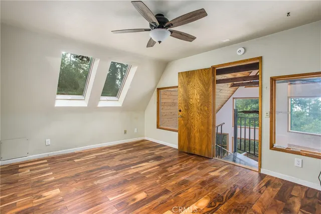 a view of livingroom with furniture window and a ceiling fan