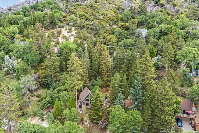 a backyard of a house with a yard and fountain