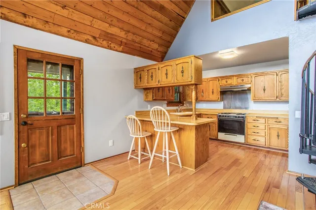 a view of an entryway with wooden floor and door