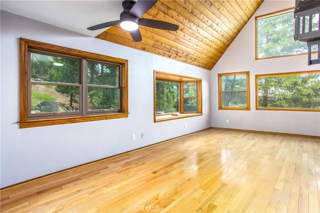 a view of a room with wooden floor