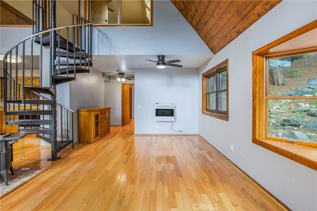 a view of a livingroom with furniture and wooden floor