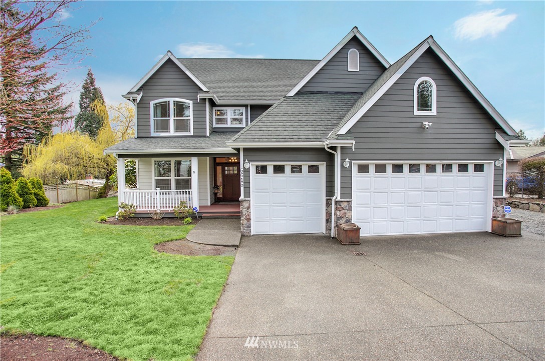 5615 Northeast 10th Street Renton, WA 98059 - Photo 1 of 35 a view of a house with a yard and porch