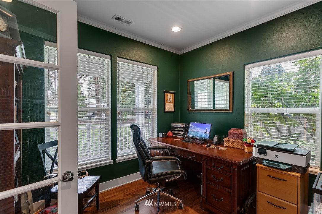 5615 Northeast 10th Street Renton, WA 98059 - Photo 17 of 35 a view of a workspace with furniture and a window
