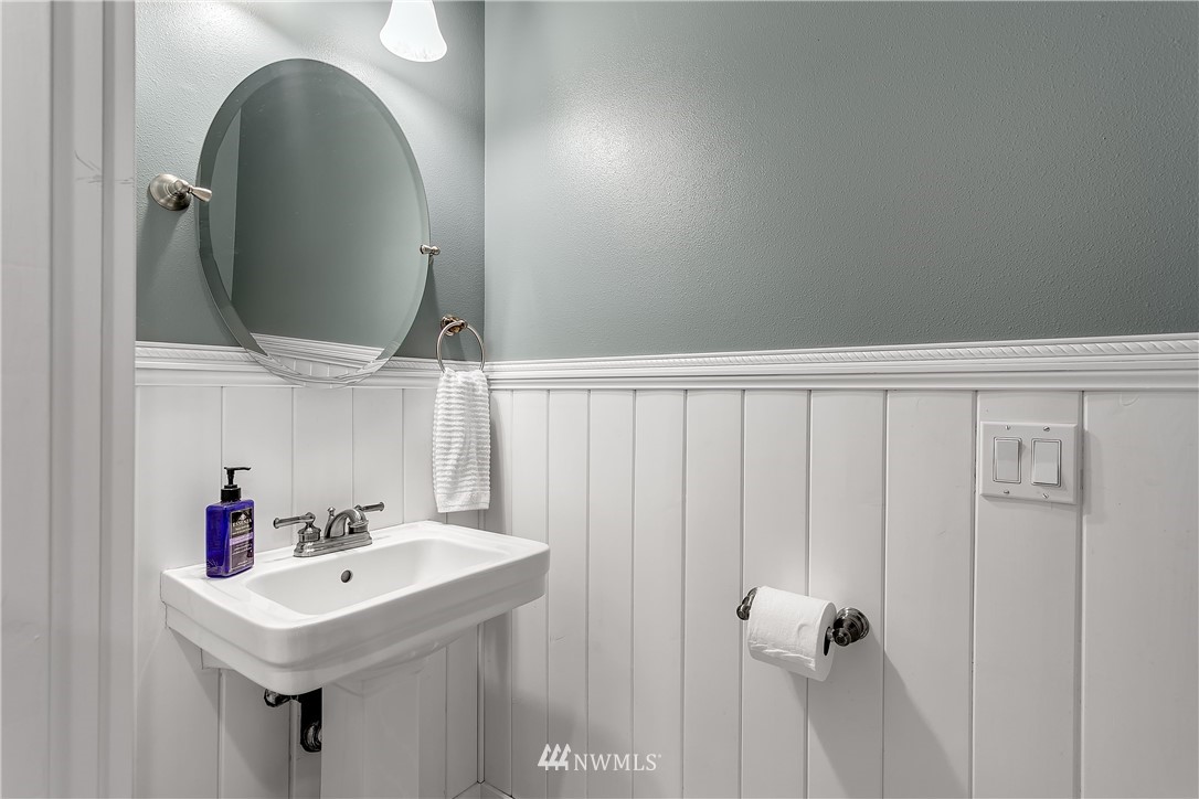 5615 Northeast 10th Street Renton, WA 98059 - Photo 18 of 35 a bathroom with a sink and mirror