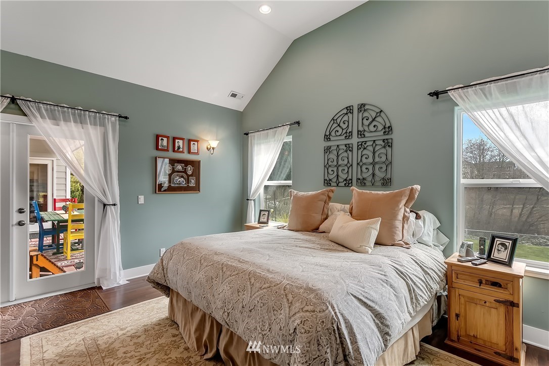 5615 Northeast 10th Street Renton, WA 98059 - Photo 24 of 35 a bedroom with a bed and a painting on the wall