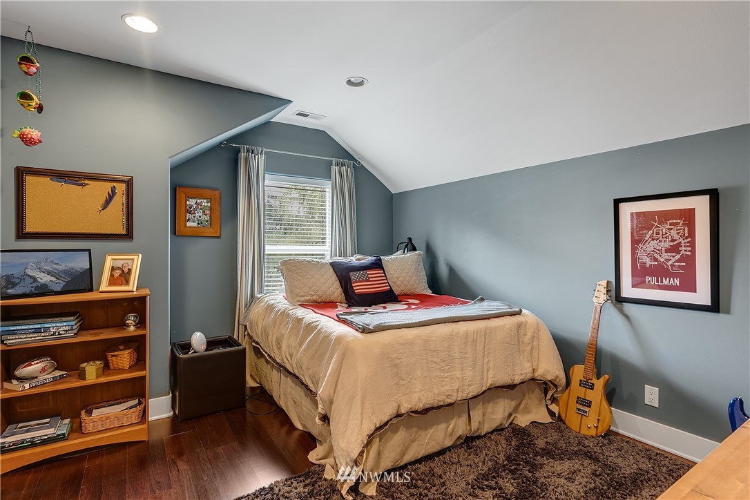 5615 Northeast 10th Street Renton, WA 98059 - Photo 28 of 35 a bedroom with a bed and a bookshelf