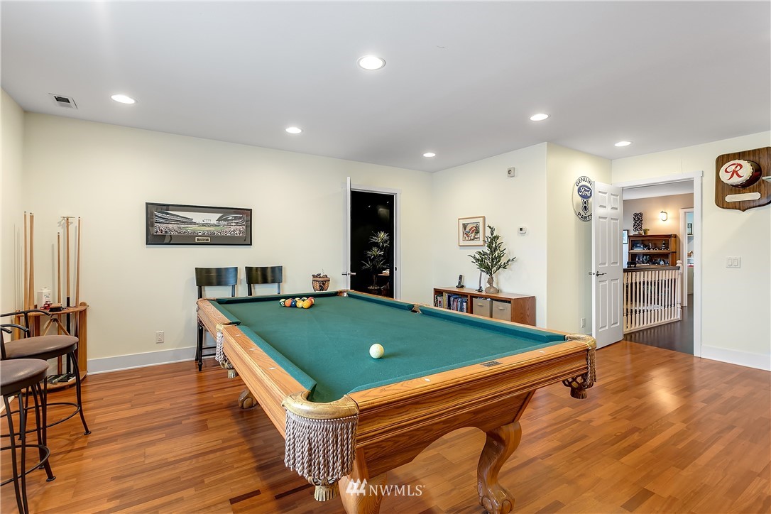 5615 Northeast 10th Street Renton, WA 98059 - Photo 29 of 35 a room with pool table and wooden floor