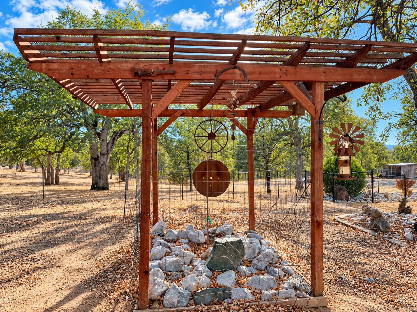 13725 Gas Point Road Igo, CA 96047 - Photo 11 of 23 Rustic Pergola with Hanging Metal Art