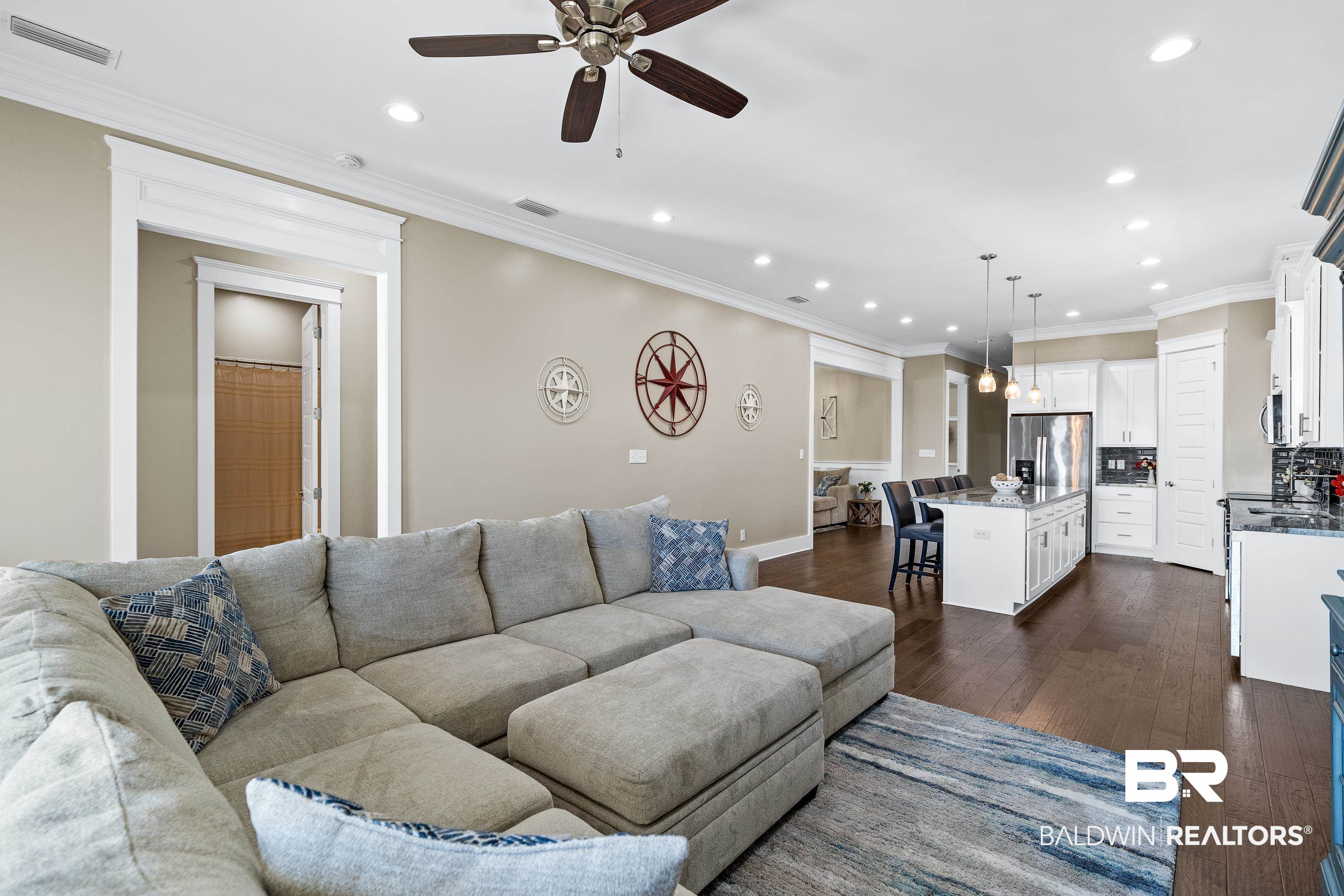 1018 Snapdragon Lane Foley, AL 36535 - Photo 9 of 37 Living room with ceiling fan, ornamental molding, and dark wood-type flooring