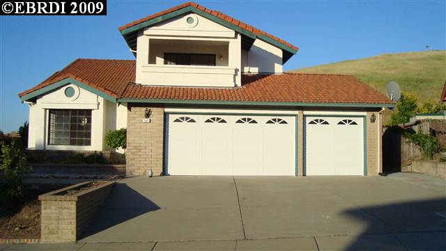 a front view of a house with parking