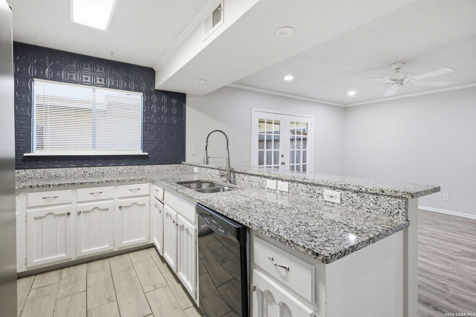 6106 Vance Jackson Road, Unit 15 San Antonio, TX 78230 - Photo 12 of 30 a kitchen with a sink stove and cabinets