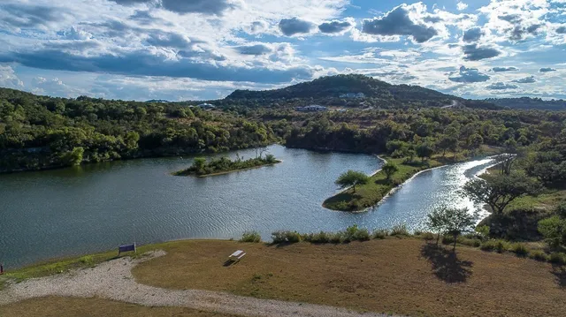 a view of a lake in middle of forest