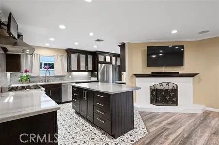 a kitchen with a stove a sink and a microwave