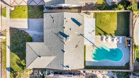 an aerial view of a house with a swimming pool