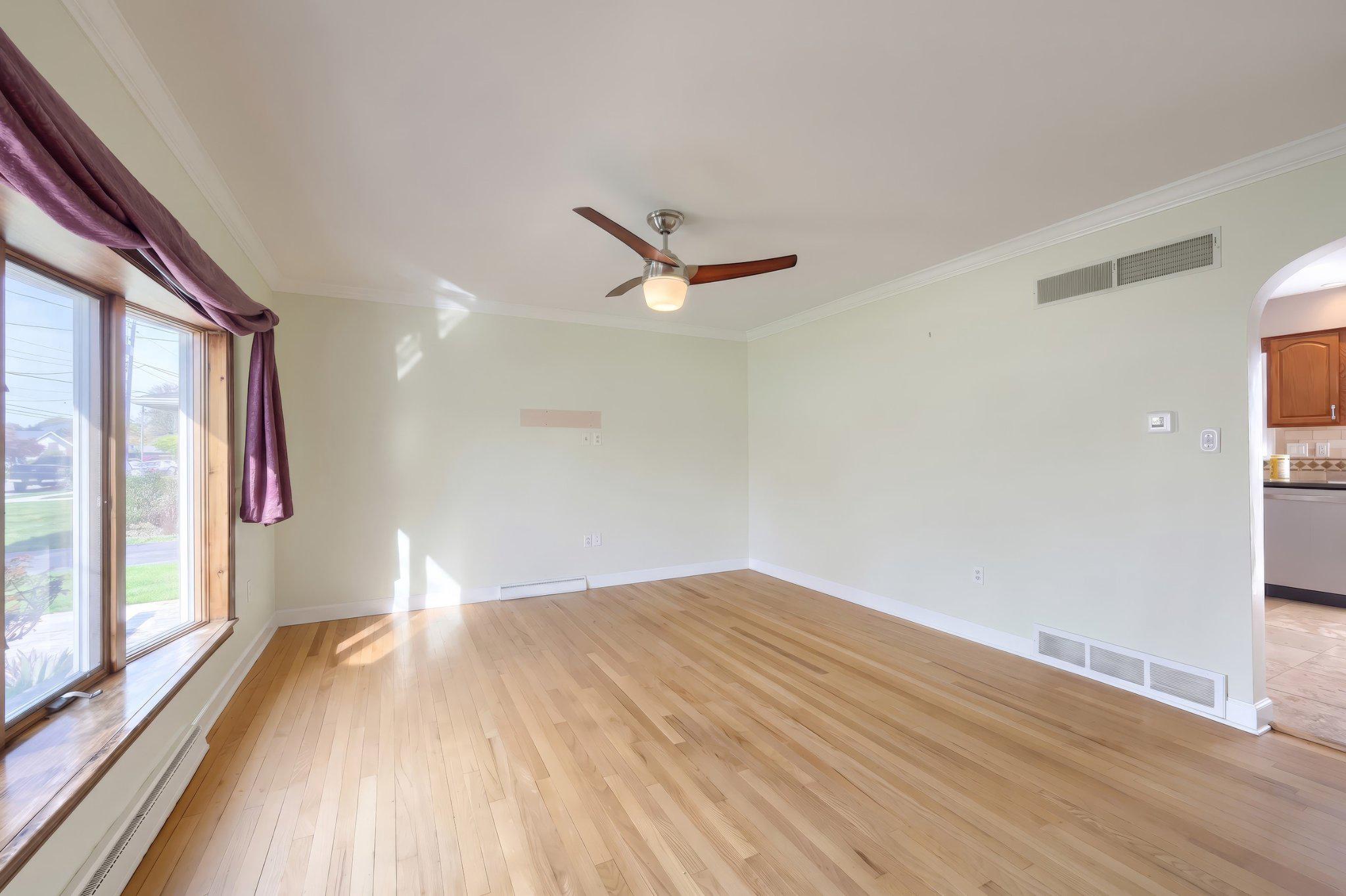 410 Diller Road Hanover, PA 17331 - Photo 16 of 41 a view of a livingroom with a ceiling fan and window
