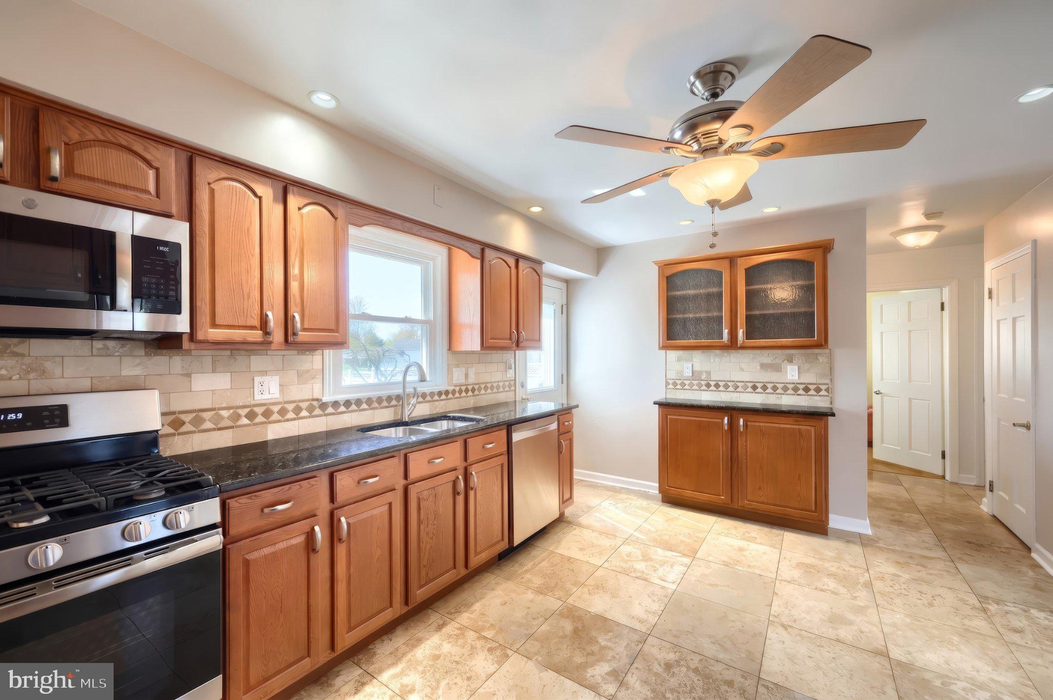 410 Diller Road Hanover, PA 17331 - Photo 19 of 41 a large kitchen with stainless steel appliances granite countertop a stove and a sink