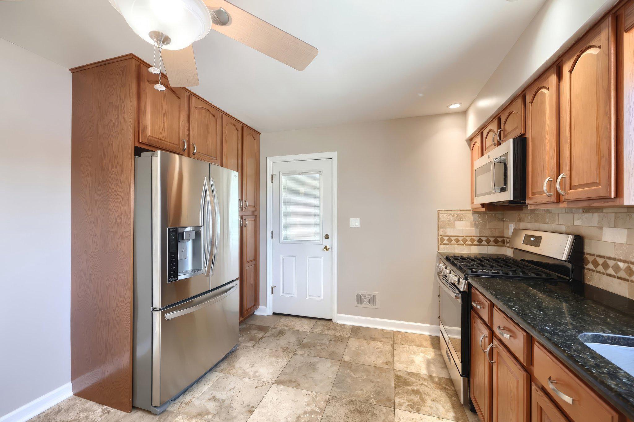 410 Diller Road Hanover, PA 17331 - Photo 20 of 41 a kitchen with stainless steel appliances granite countertop a refrigerator a stove and a sink with cabinets