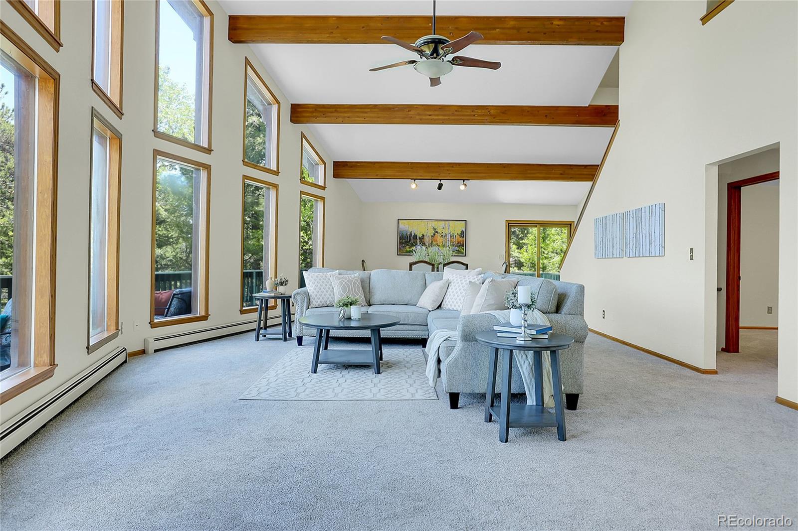 11333 Conifer Mountain Road Conifer, CO 80433 - Photo 12 of 50 a living room with furniture and a large window