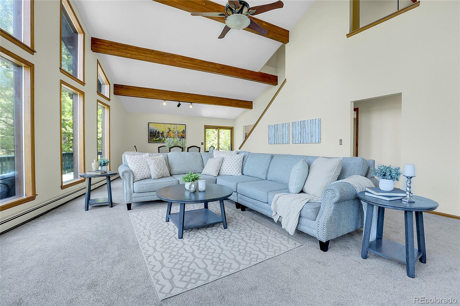 11333 Conifer Mountain Road Conifer, CO 80433 - Photo 13 of 50 a living room with furniture and a large window