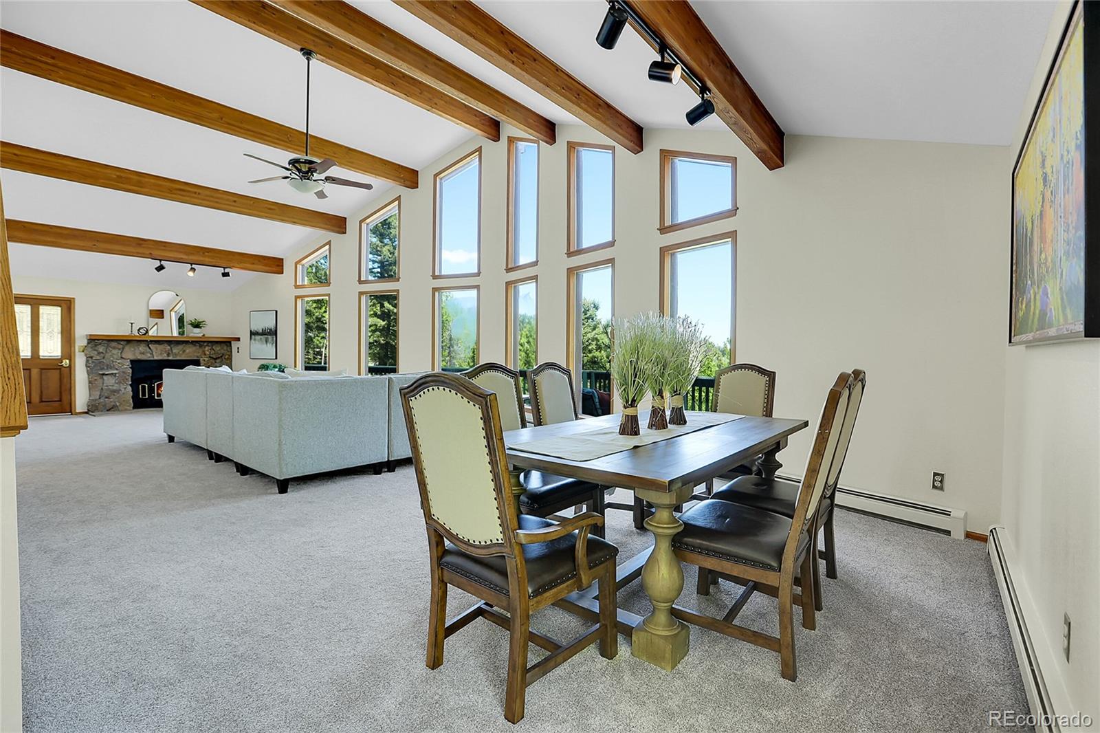11333 Conifer Mountain Road Conifer, CO 80433 - Photo 20 of 50 a view of a dining room with furniture