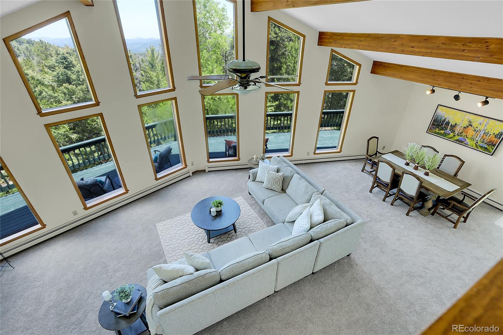 11333 Conifer Mountain Road Conifer, CO 80433 - Photo 30 of 50 a living room with furniture and a window
