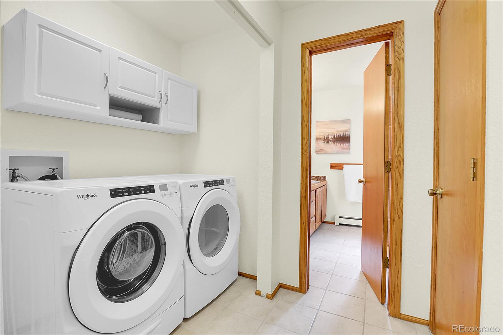 11333 Conifer Mountain Road Conifer, CO 80433 - Photo 35 of 50 a utility room with dryer and washer