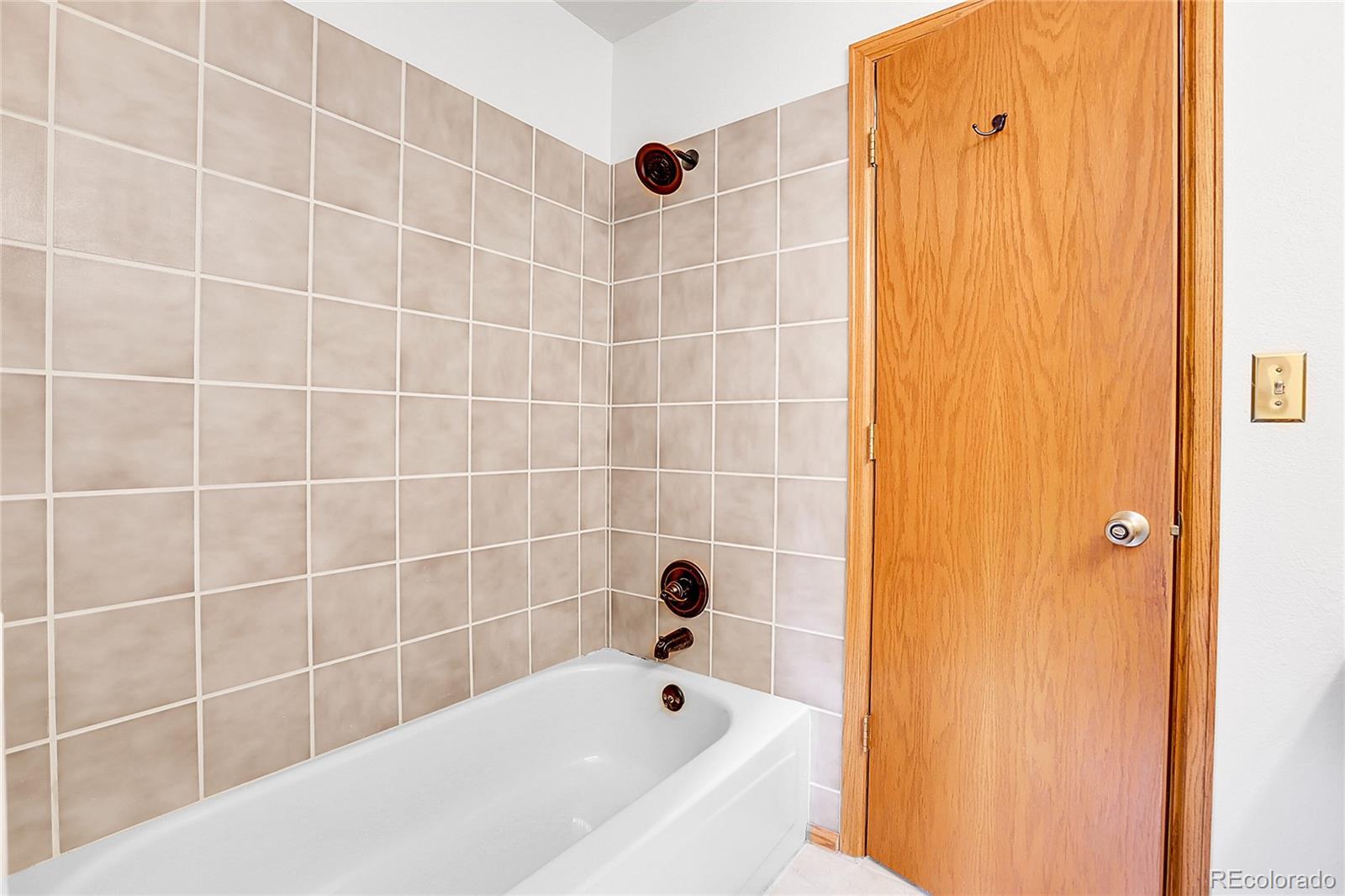 11333 Conifer Mountain Road Conifer, CO 80433 - Photo 37 of 50 a bathroom with a bathtub