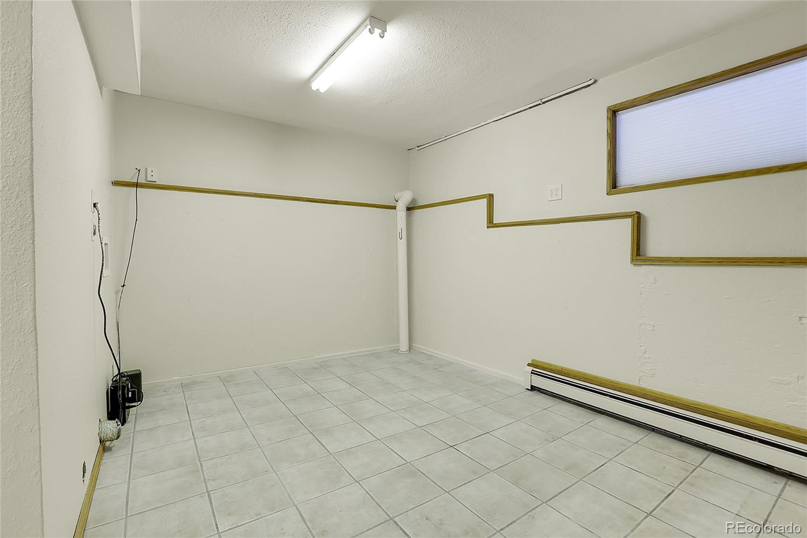 11333 Conifer Mountain Road Conifer, CO 80433 - Photo 44 of 50 a view of a room with racks on the wall