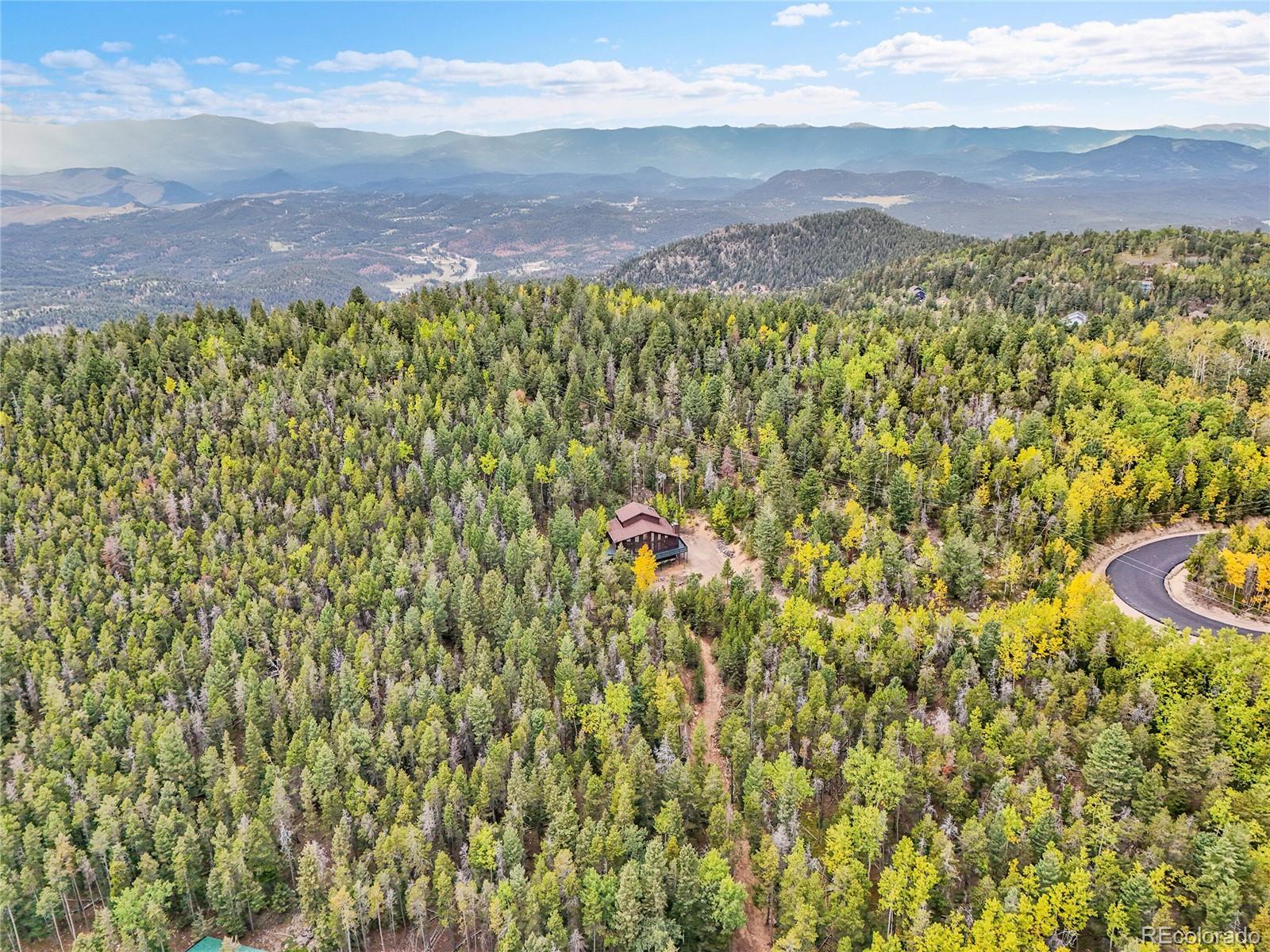 11333 Conifer Mountain Road Conifer, CO 80433 - Photo 46 of 50 a view of a area with an umbrella