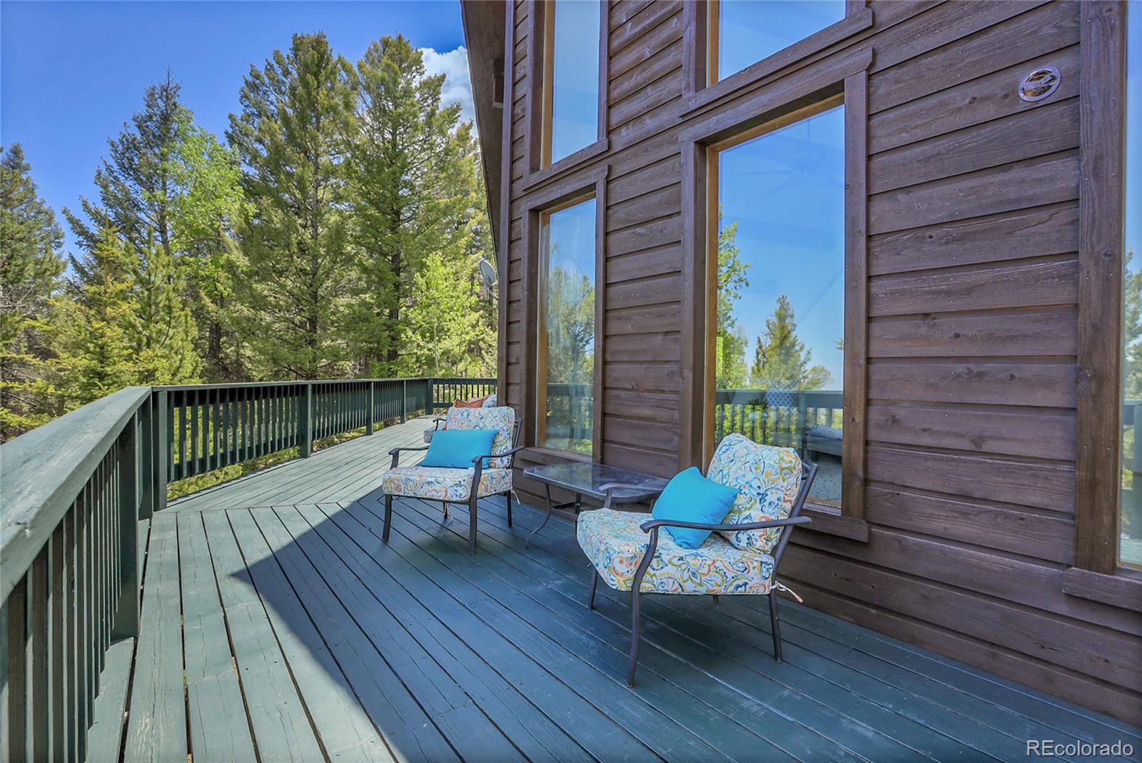 11333 Conifer Mountain Road Conifer, CO 80433 - Photo 49 of 50 a sitting area with furniture on wooden deck